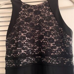 Glamorous black dress with nude lace top and slit skirt